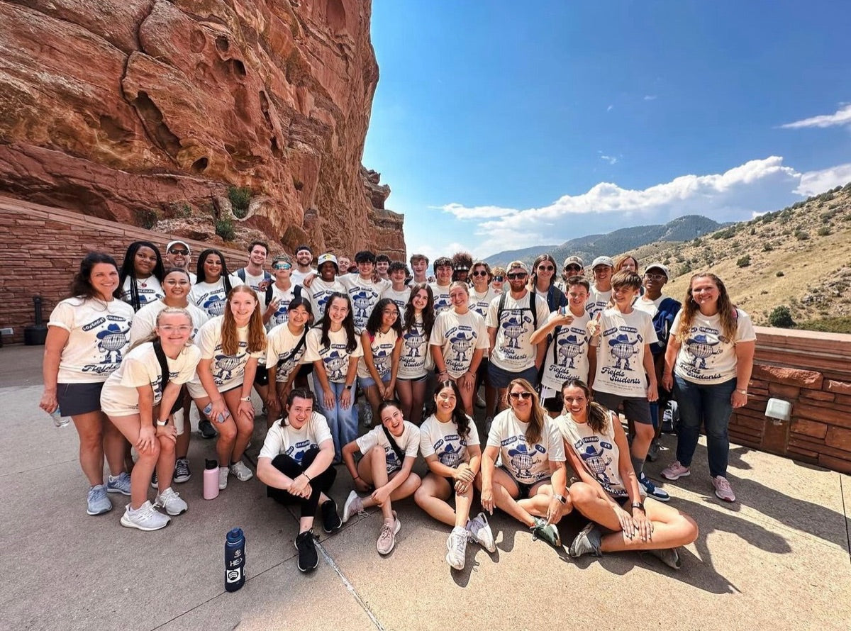 Student group at Red Rocks in cream Colorado tees