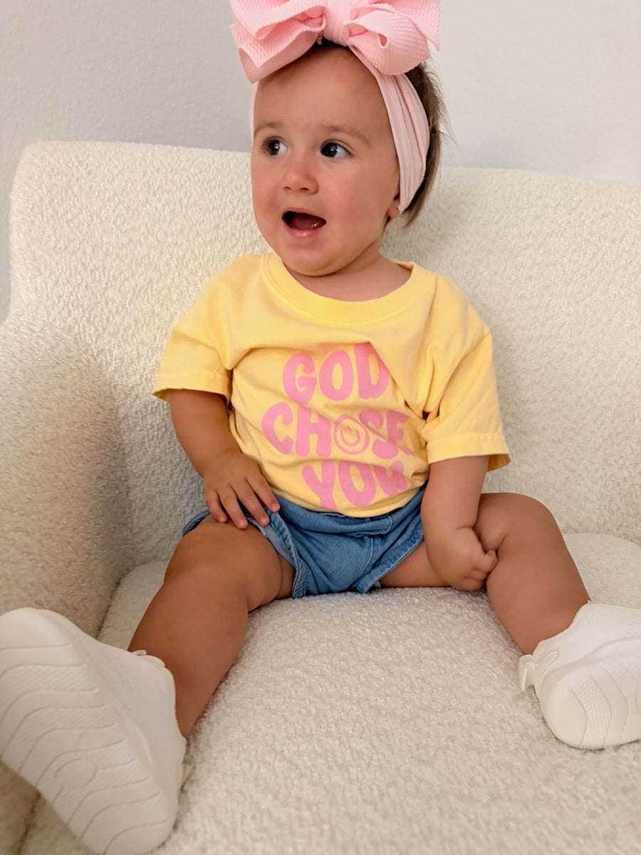 Baby in a yellow God Chose You tee